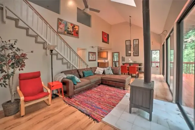 a living room with furniture and a rug