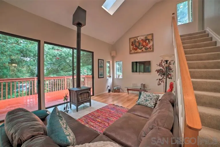 16885 Laurel Road Los Gatos, CA 95033 - Photo 6 of 40 a living room with furniture and a floor to ceiling window