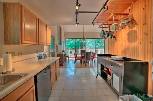 a kitchen with a sink and a stove top oven