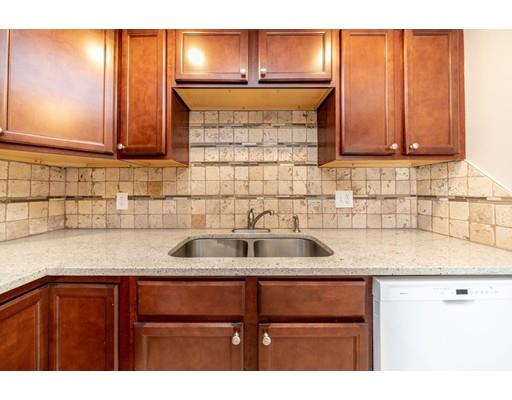 28 Barnet Street Springfield, MA 01129 - Photo 12 of 26 a kitchen with stainless steel appliances granite countertop wooden cabinets and a sink