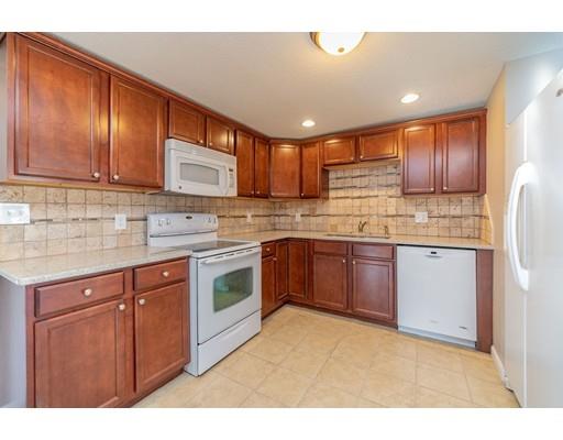 28 Barnet Street Springfield, MA 01129 - Photo 13 of 26 a kitchen with stainless steel appliances granite countertop a stove a sink dishwasher and a refrigerator