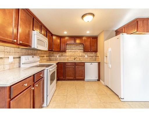 28 Barnet Street Springfield, MA 01129 - Photo 14 of 26 a kitchen with stainless steel appliances granite countertop a stove a sink dishwasher and a refrigerator