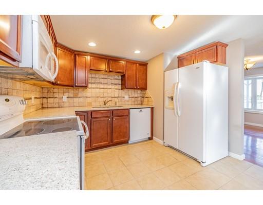 28 Barnet Street Springfield, MA 01129 - Photo 15 of 26 a kitchen with stainless steel appliances granite countertop a refrigerator a sink and a stove