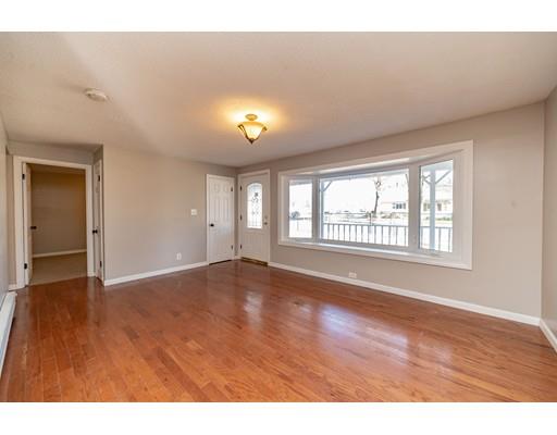 28 Barnet Street Springfield, MA 01129 - Photo 6 of 26 a view of an empty room with wooden floor and a window