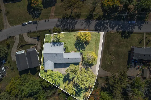 an aerial view of a house with a garden