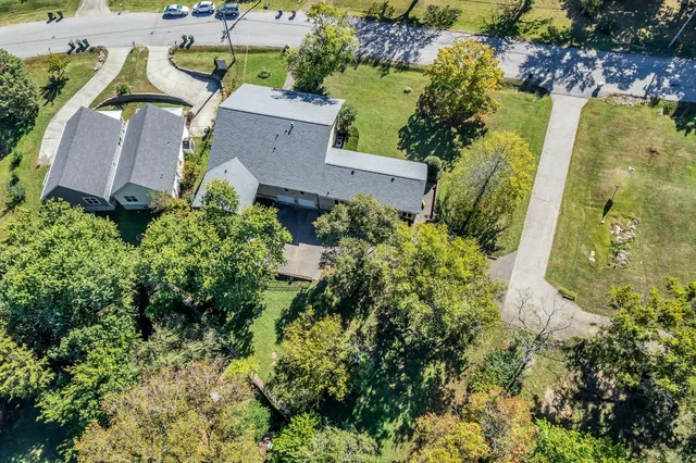 an aerial view of residential house with outdoor space and swimming pool