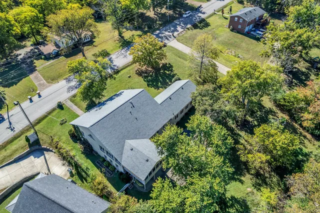 an aerial view of house with yard