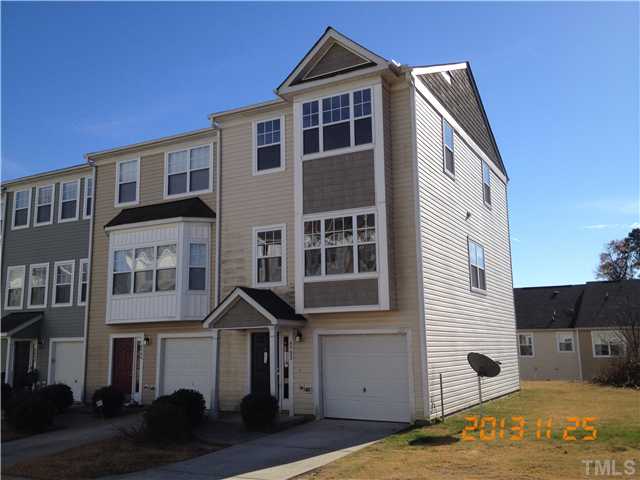 4902 Midstone Lane Raleigh, NC 27610 - Photo 1 of 7 a front view of a house with a yard