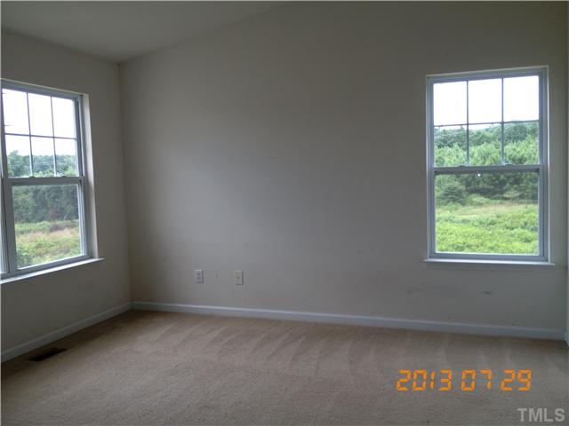 4902 Midstone Lane Raleigh, NC 27610 - Photo 3 of 7 an empty room with a window