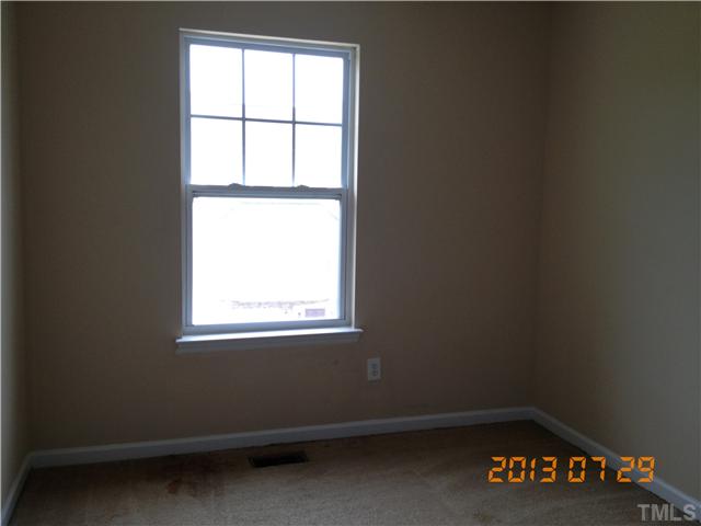 4902 Midstone Lane Raleigh, NC 27610 - Photo 6 of 7 an empty room with a window