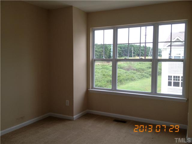 4902 Midstone Lane Raleigh, NC 27610 - Photo 7 of 7 an empty room with a window