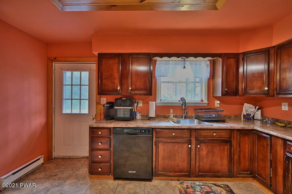 127 Estates Road Greentown, PA 18426 - Photo 28 of 85 a kitchen with stainless steel appliances granite countertop a sink and cabinets