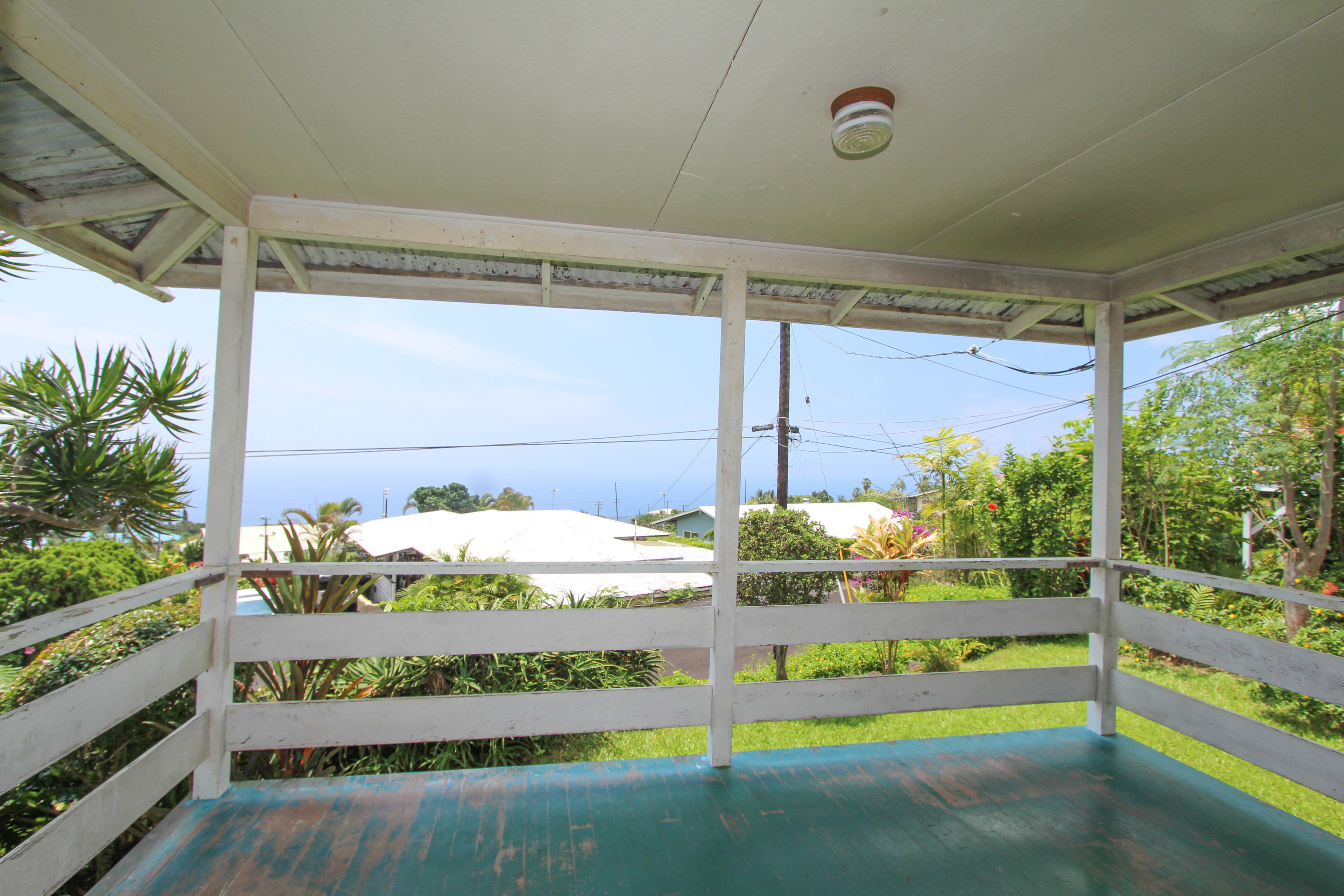 82-1025 Kinue Road Captain Cook, HI 96704 - Photo 11 of 12 a front view of a house with a yard balcony