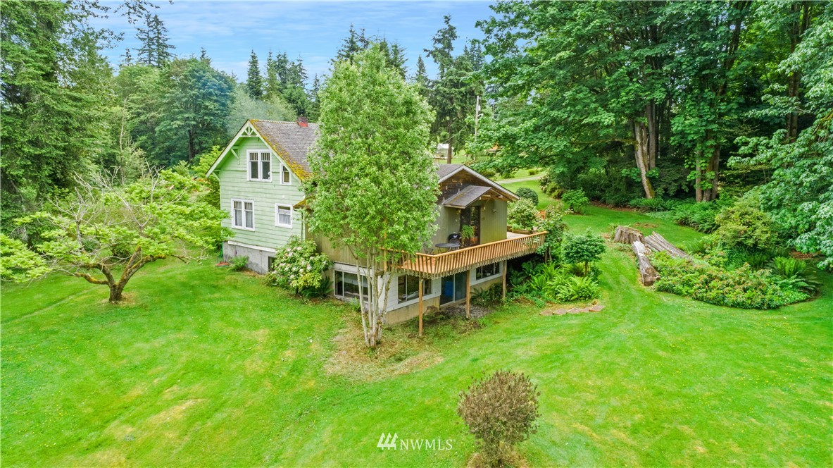 16825 Three Lakes Road Snohomish, WA 98290 - Photo 22 of 32 a view of a house with a big yard and large trees