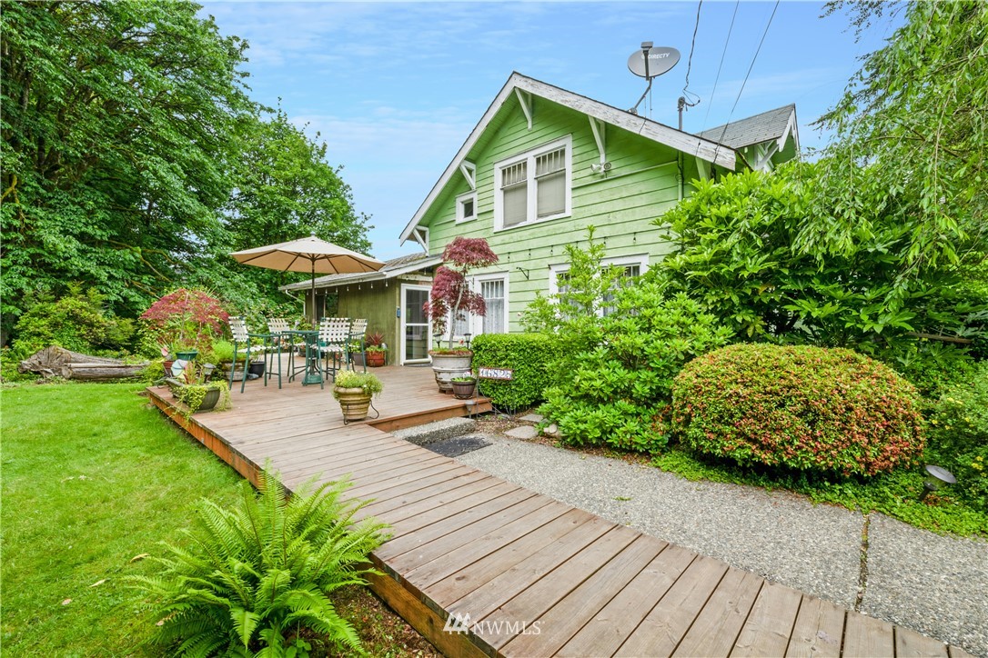 16825 Three Lakes Road Snohomish, WA 98290 - Photo 6 of 32 a front view of a house with garden and sitting area