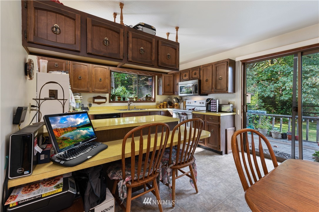 16825 Three Lakes Road Snohomish, WA 98290 - Photo 8 of 32 a view of a dining room with furniture window and outside view