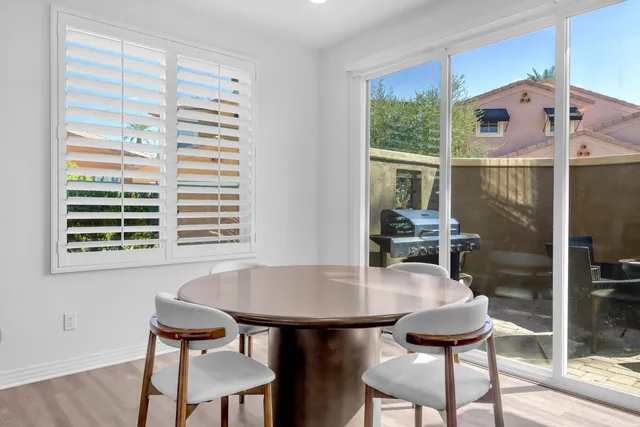a kitchen with stainless steel appliances granite countertop wooden cabinets granite counter tops and a stove