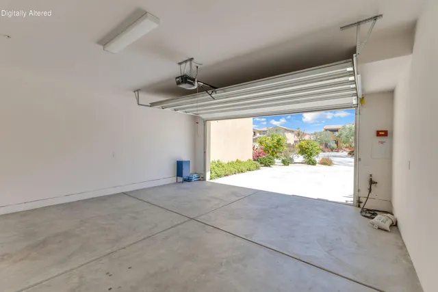 an aerial view of a house with a garden and lake view
