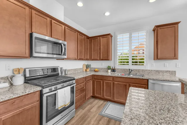 a front view of a house with a yard and fountain