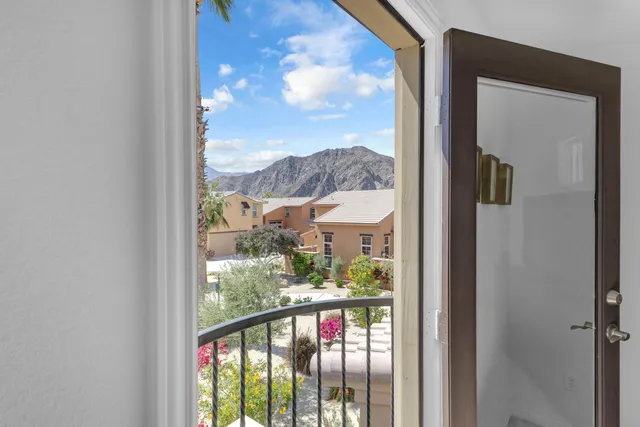 a view of a balcony with furniture
