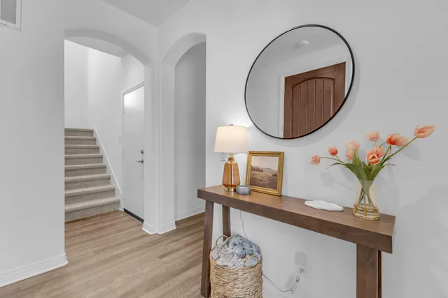 a view of a dining room with furniture and a window