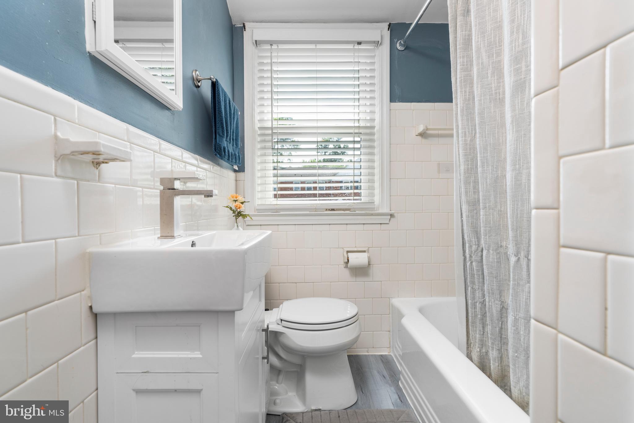 1606 Loch Ness Road Baltimore, MD 21286 - Photo 14 of 36 a bathroom with a bathtub sink and toilet