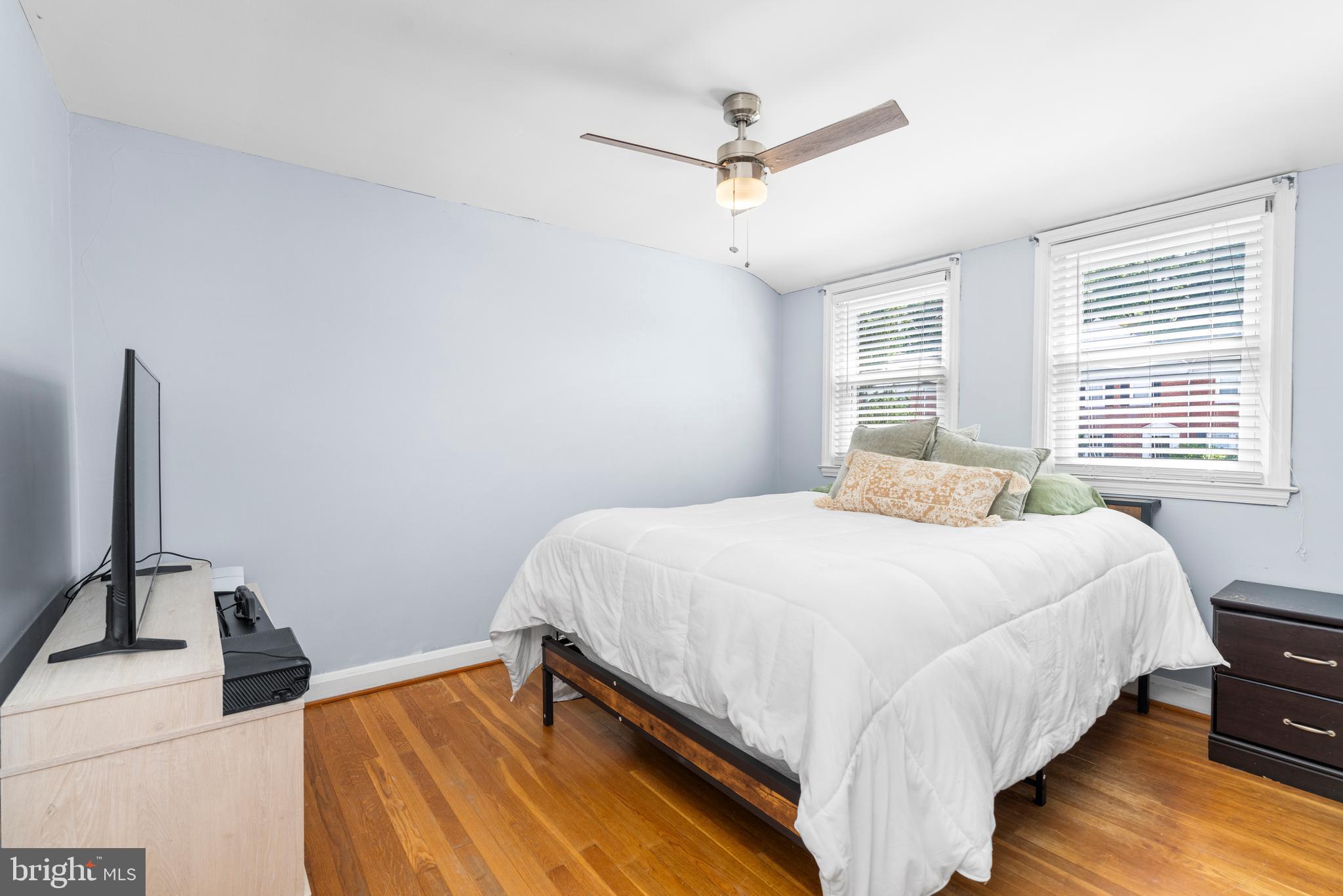 1606 Loch Ness Road Baltimore, MD 21286 - Photo 16 of 36 a bedroom with a bed and a large window