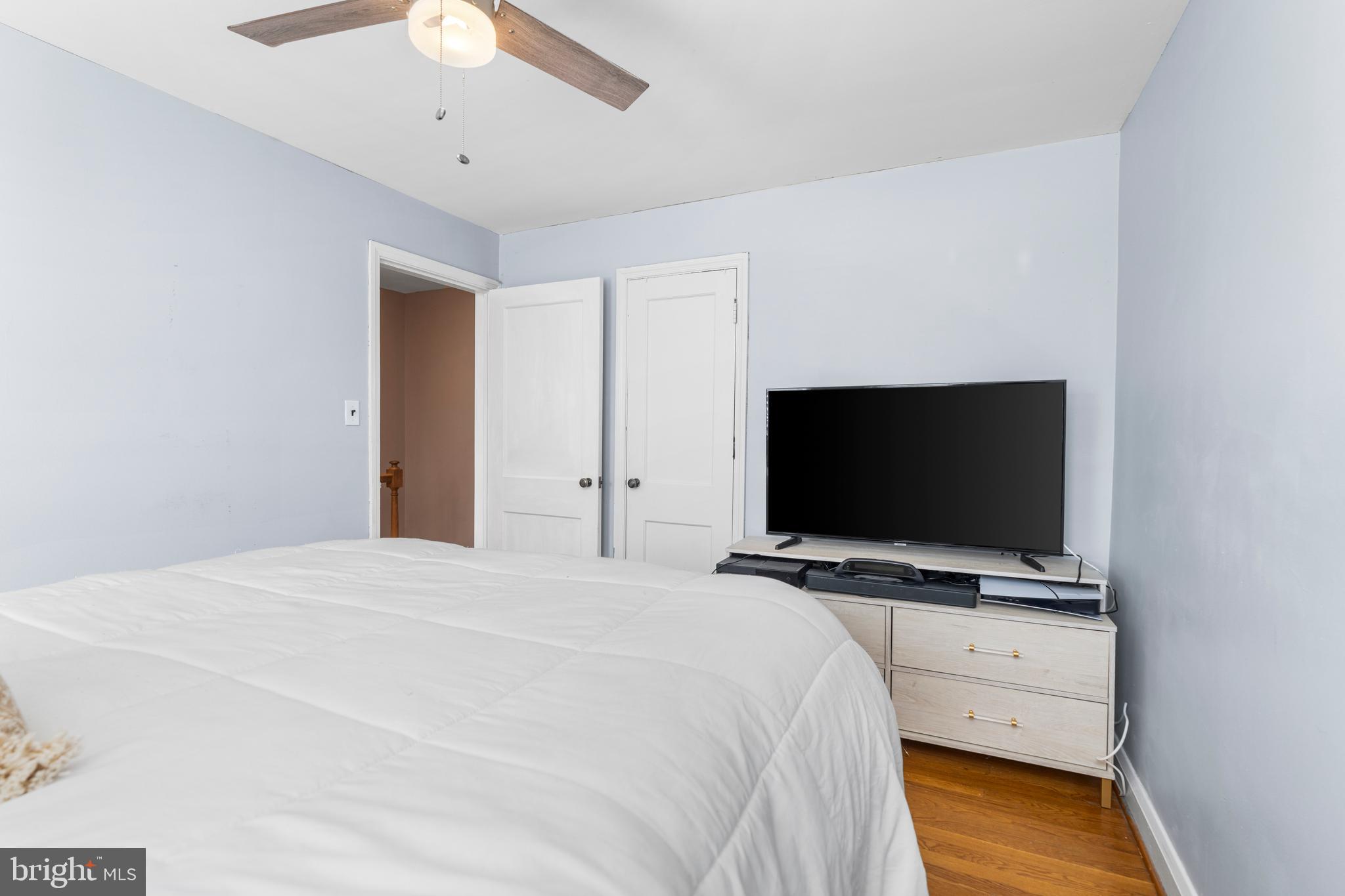 1606 Loch Ness Road Baltimore, MD 21286 - Photo 17 of 36 a bedroom with a bed and a flat screen tv