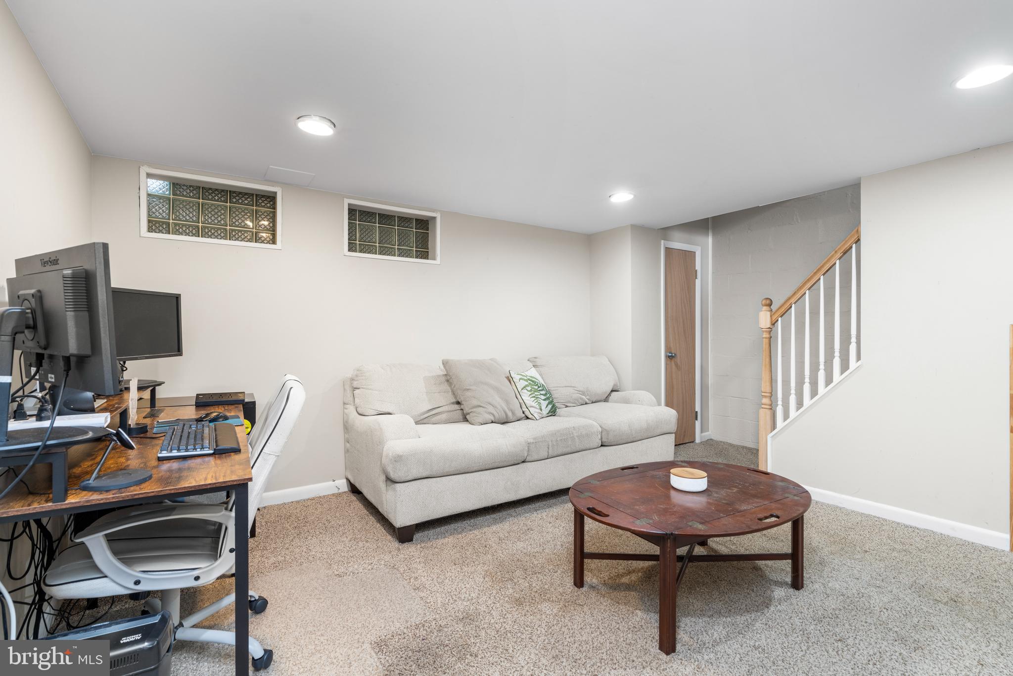 1606 Loch Ness Road Baltimore, MD 21286 - Photo 22 of 36 a living room with furniture and a flat screen tv