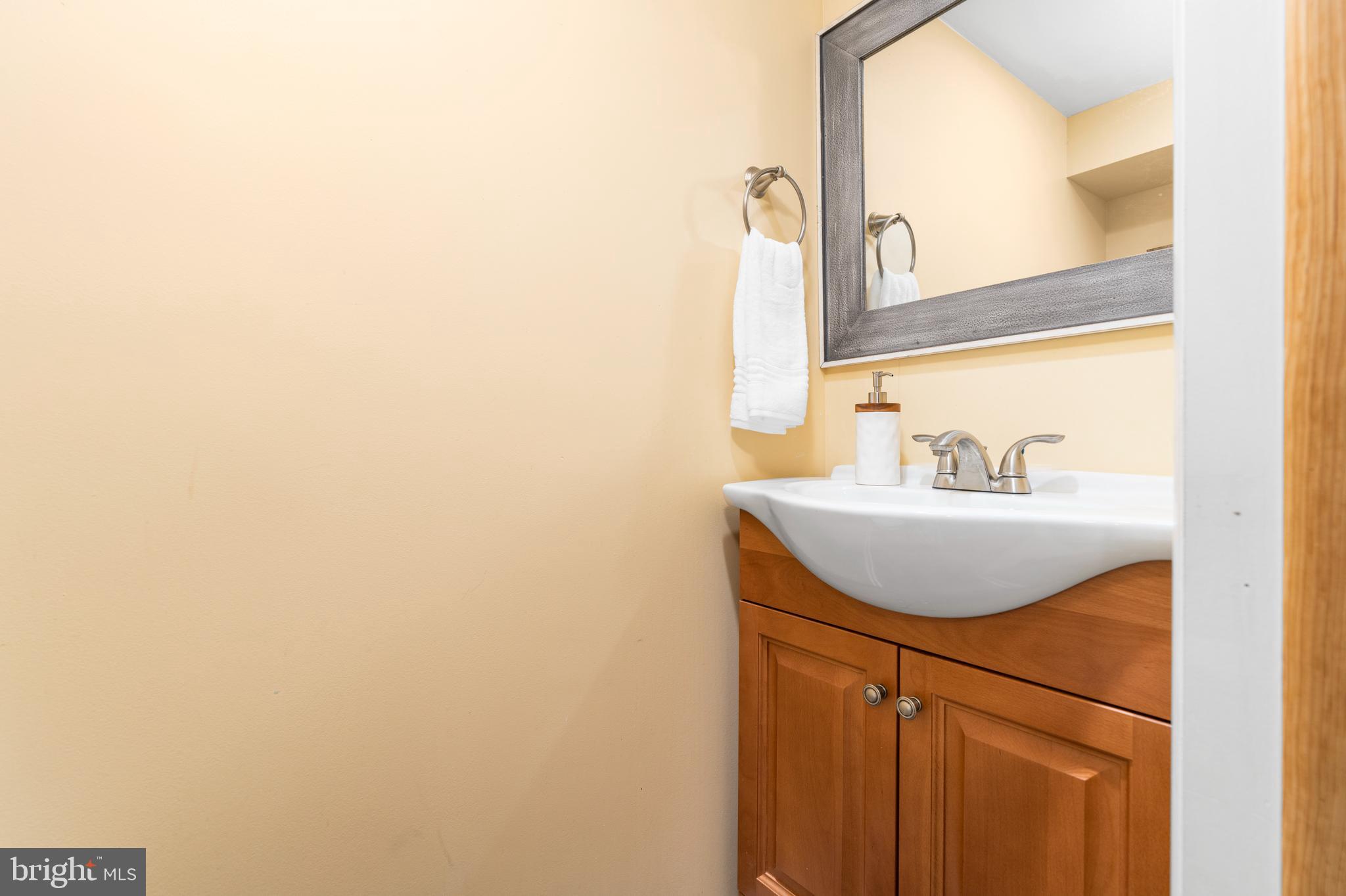 1606 Loch Ness Road Baltimore, MD 21286 - Photo 24 of 36 a bathroom with a sink and a mirror