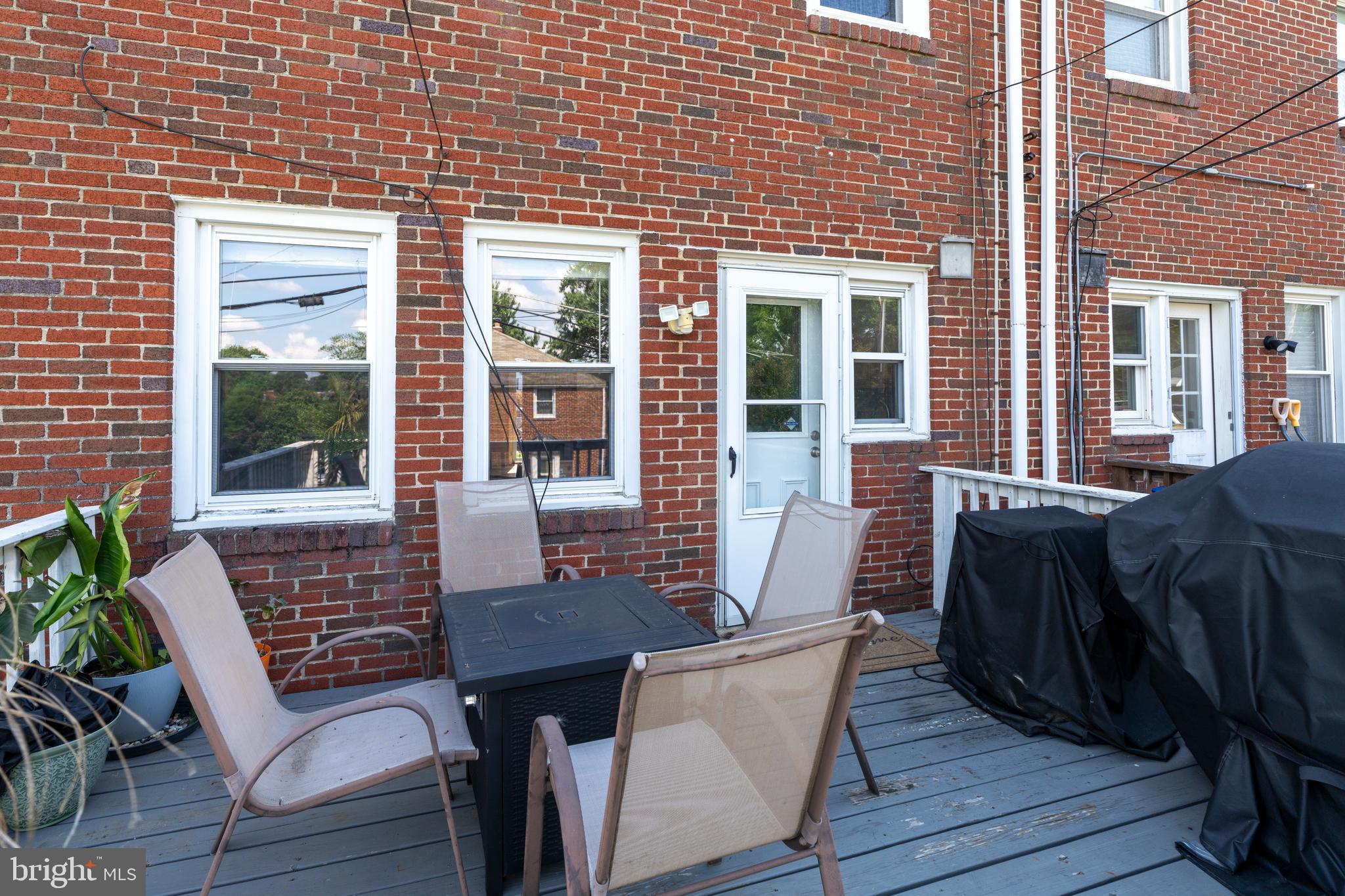 1606 Loch Ness Road Baltimore, MD 21286 - Photo 30 of 36 a view of a patio with table and chairs