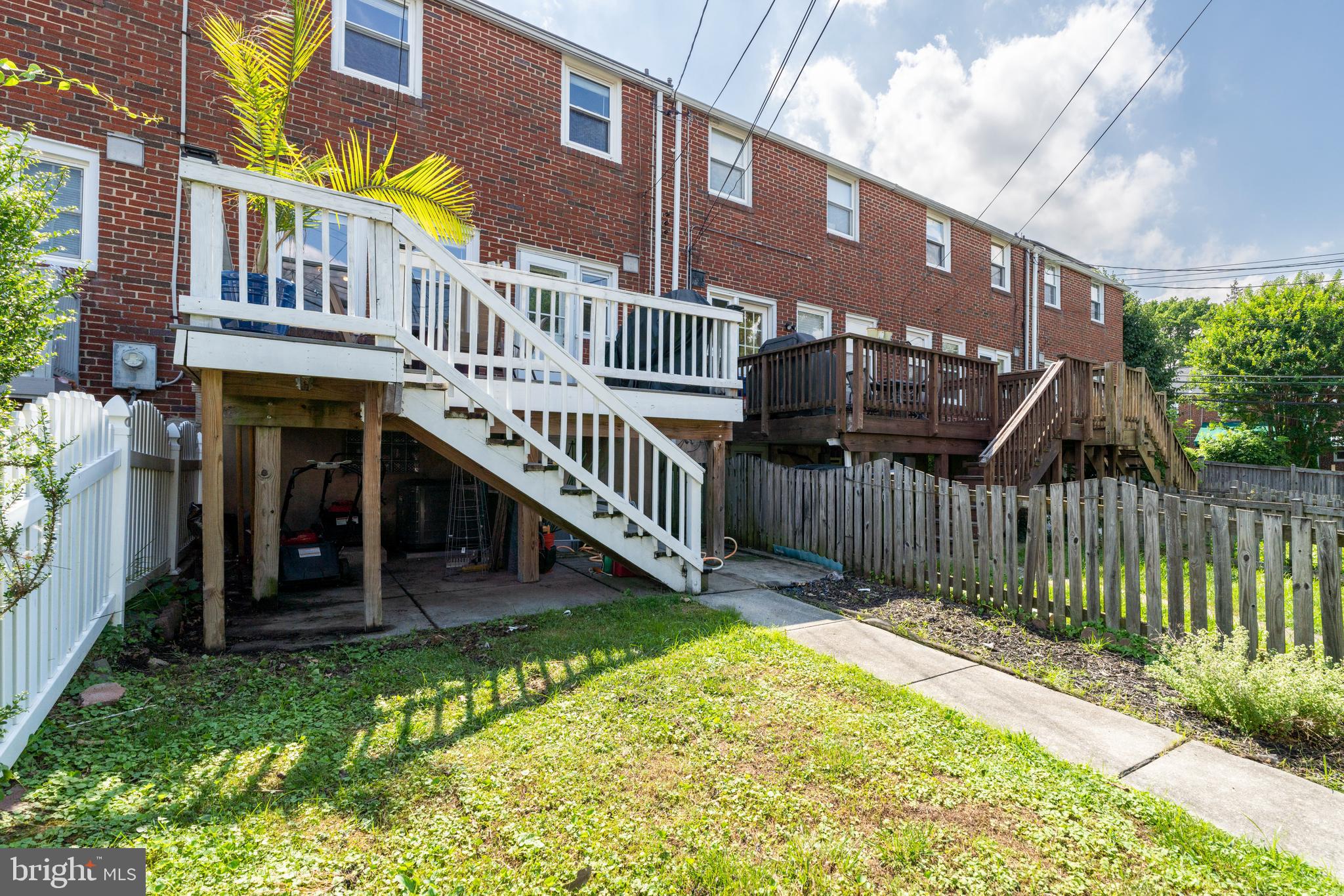1606 Loch Ness Road Baltimore, MD 21286 - Photo 35 of 36 a view of a house with a small yard and wooden deck