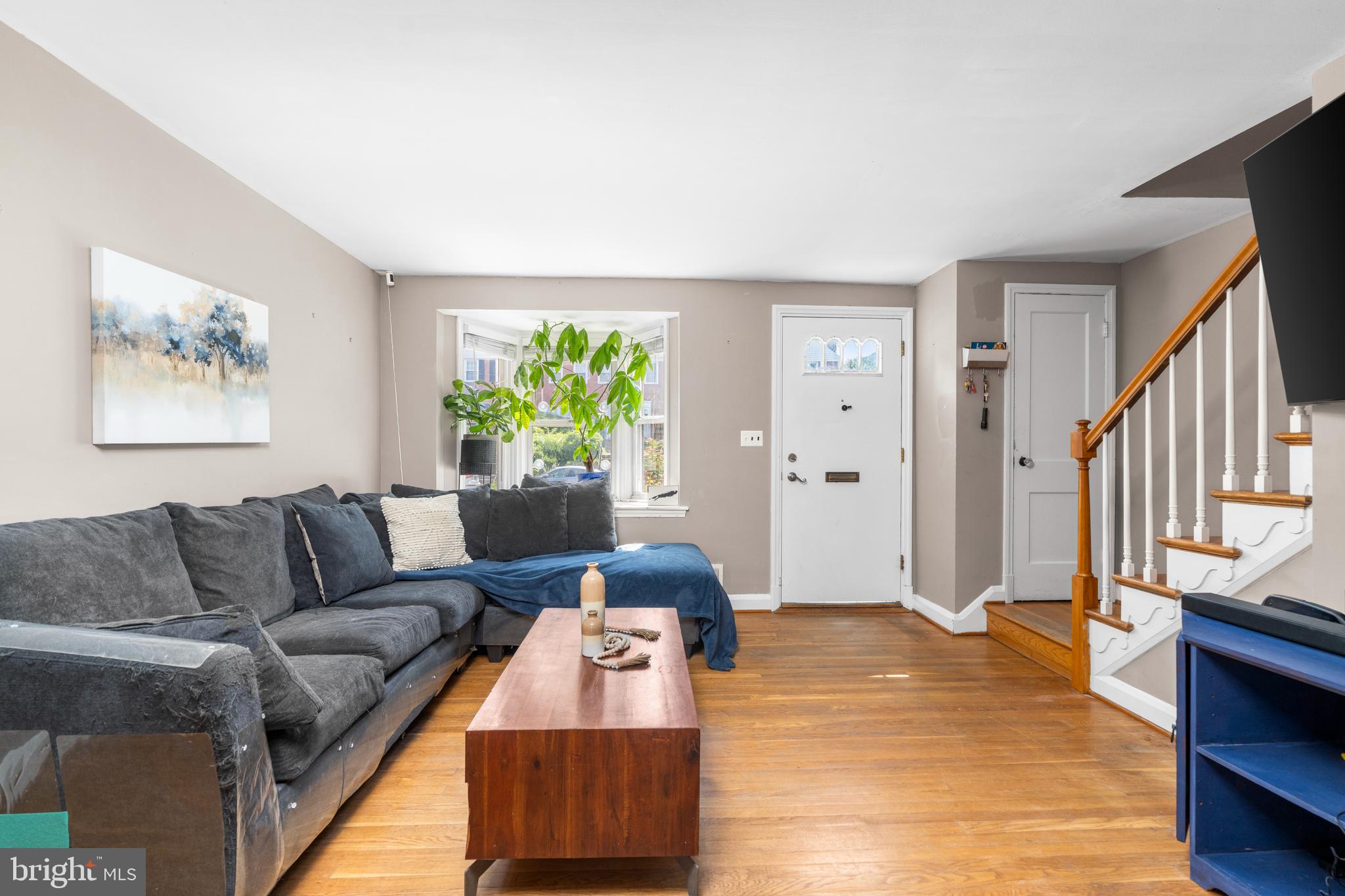 1606 Loch Ness Road Baltimore, MD 21286 - Photo 5 of 36 a living room with furniture and a wooden floor