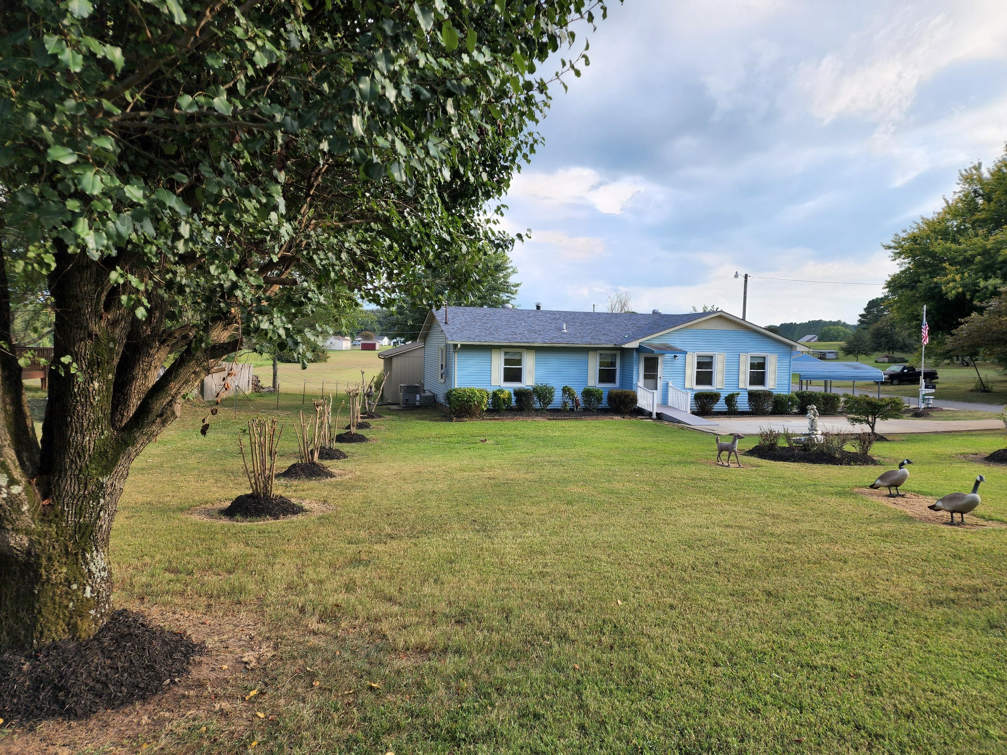 514 West Point Road Lawrenceburg, TN 38464 - Photo 1 of 25 a front view of a house with swimming pool and porch