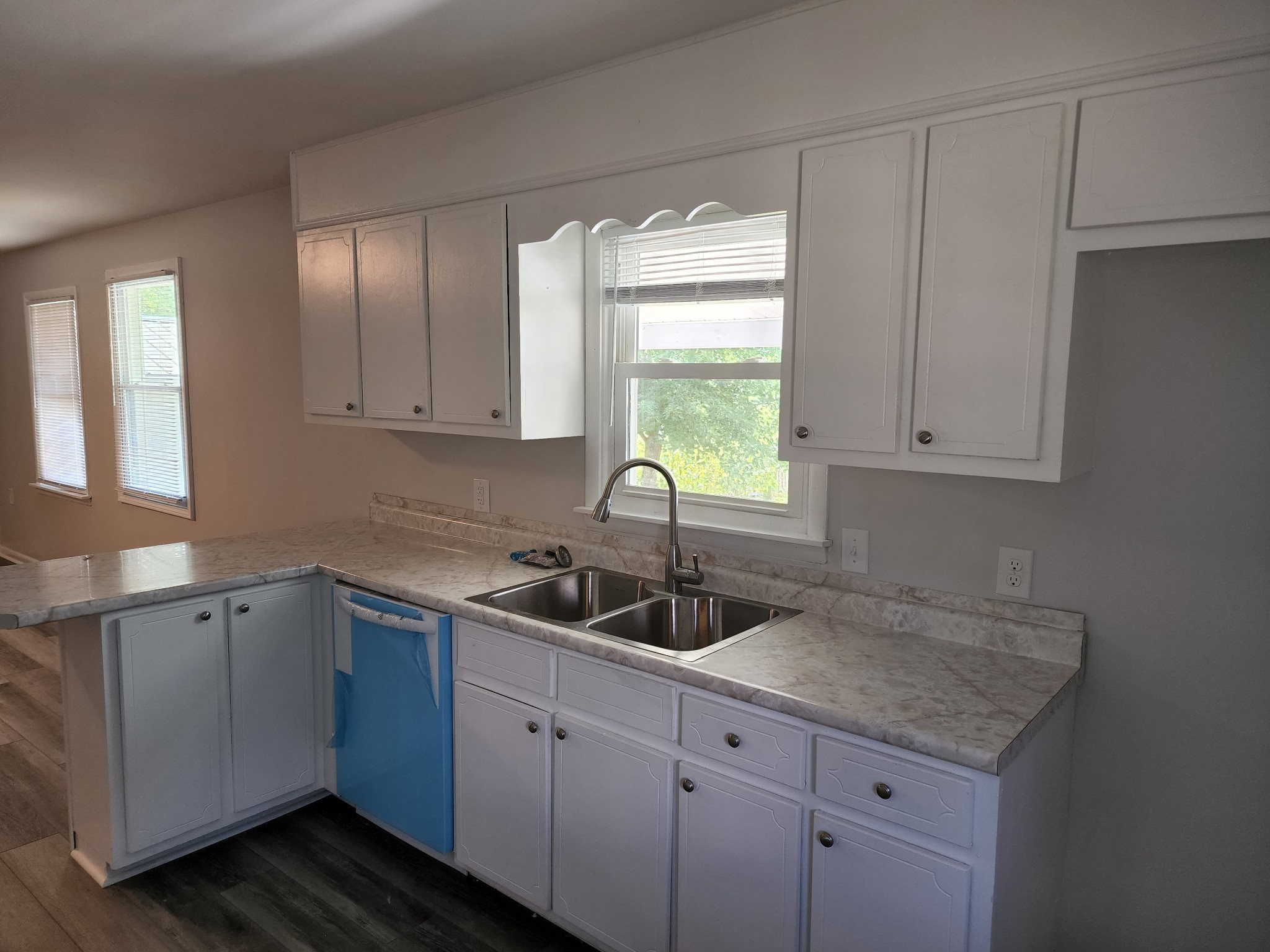 514 West Point Road Lawrenceburg, TN 38464 - Photo 9 of 25 a kitchen with a sink cabinets and window