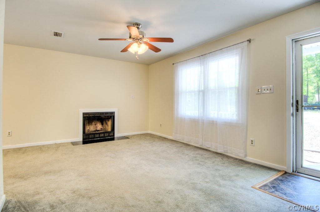 7806 Brightridge Road Chesterfield, VA 23832 - Photo 8 of 27 an empty room with windows and chandelier fan