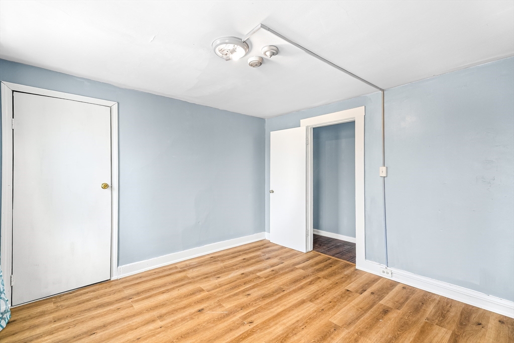 184 Myrtle Street Brockton, MA 02301 - Photo 17 of 41 a view of empty room with wooden floor