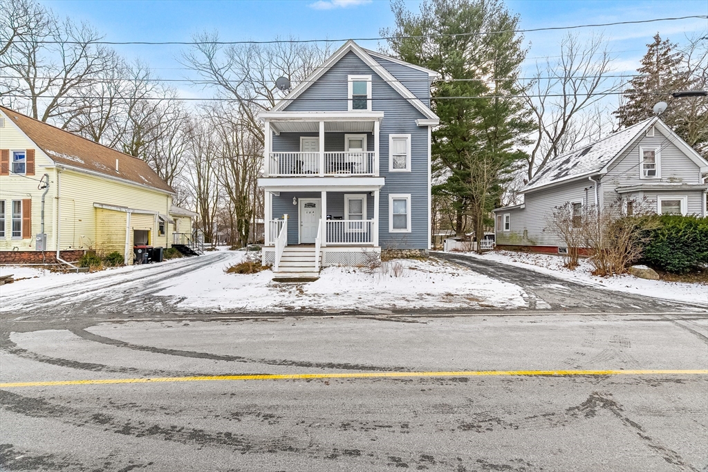 184 Myrtle Street Brockton, MA 02301 - Photo 2 of 41 a white house that has a tree on the side of it