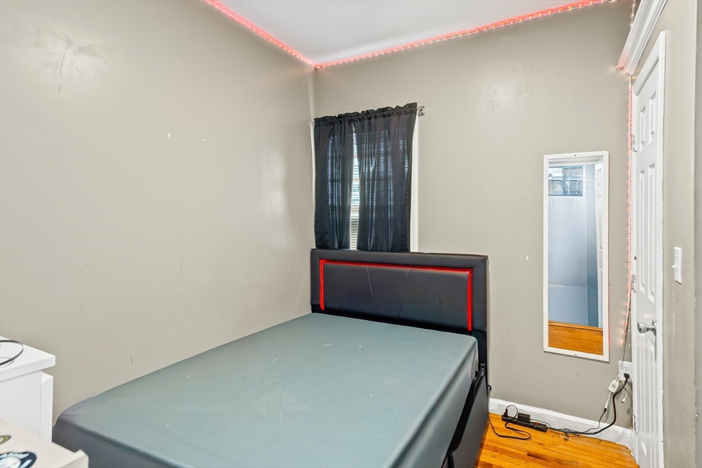 184 Myrtle Street Brockton, MA 02301 - Photo 24 of 41 a bedroom with a bed and a window