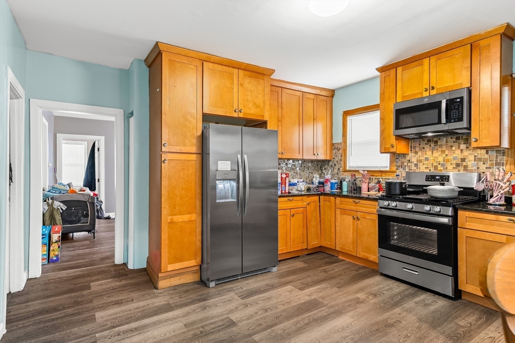 184 Myrtle Street Brockton, MA 02301 - Photo 28 of 41 a kitchen with stainless steel appliances granite countertop a refrigerator stove and sink