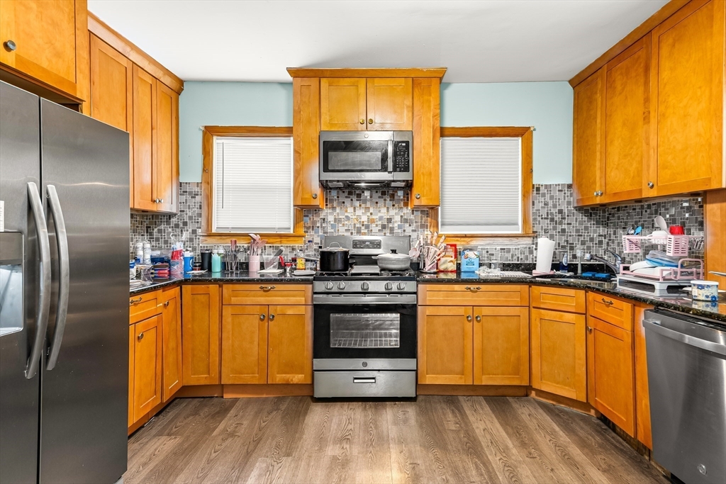 184 Myrtle Street Brockton, MA 02301 - Photo 29 of 41 a kitchen with stainless steel appliances granite countertop a stove and refrigerator