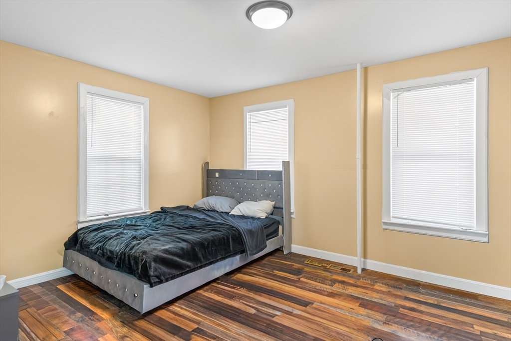 184 Myrtle Street Brockton, MA 02301 - Photo 31 of 41 a bedroom with a bed and window