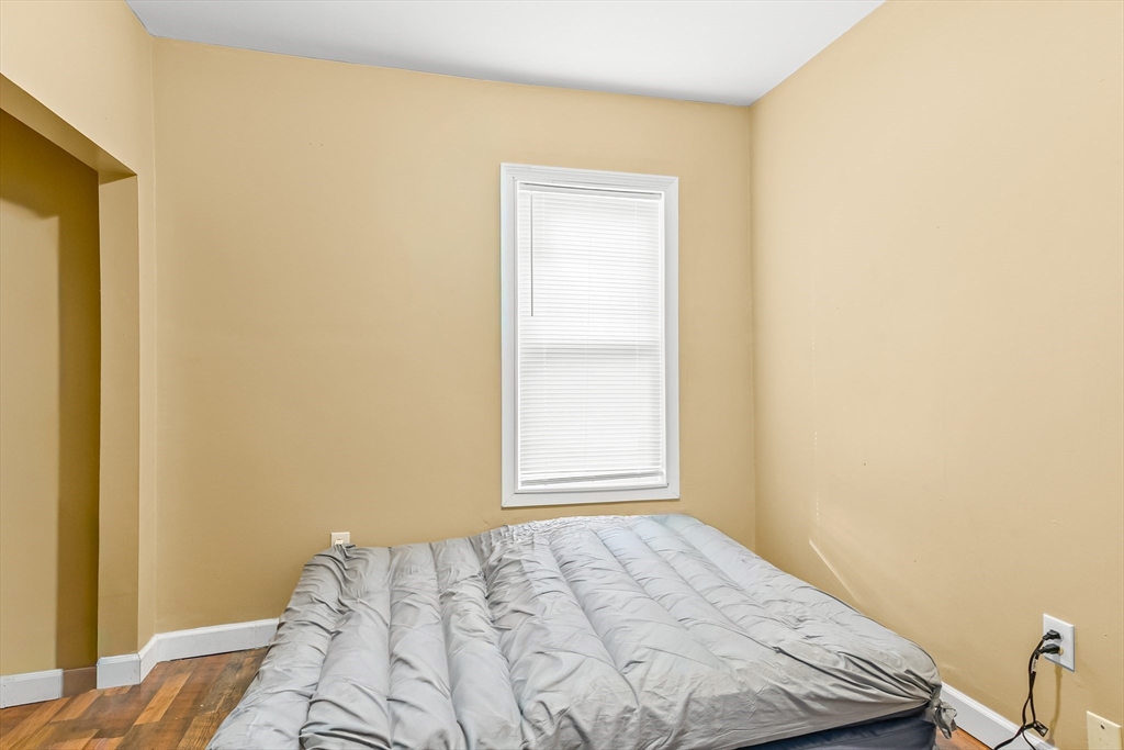184 Myrtle Street Brockton, MA 02301 - Photo 34 of 41 a bedroom with a bed and a window