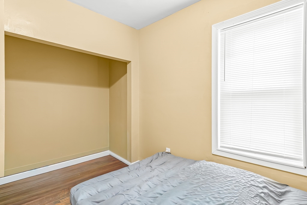 184 Myrtle Street Brockton, MA 02301 - Photo 35 of 41 a view of a room with wooden floor and a window