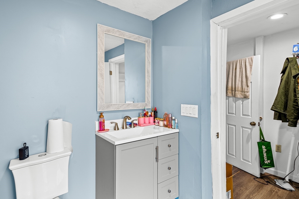 184 Myrtle Street Brockton, MA 02301 - Photo 37 of 41 a bathroom with a sink toilet vanity and tub