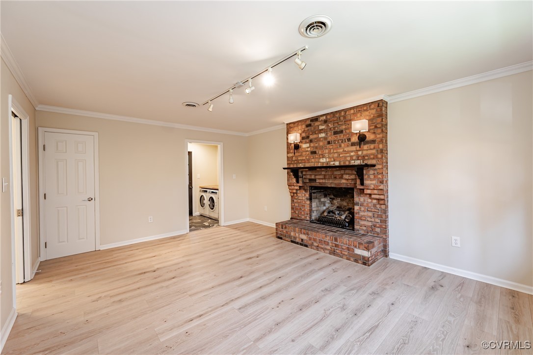 16120 Rowlett Road Chesterfield, VA 23838 - Photo 16 of 25 a view of a livingroom with wooden floor a fireplace and window