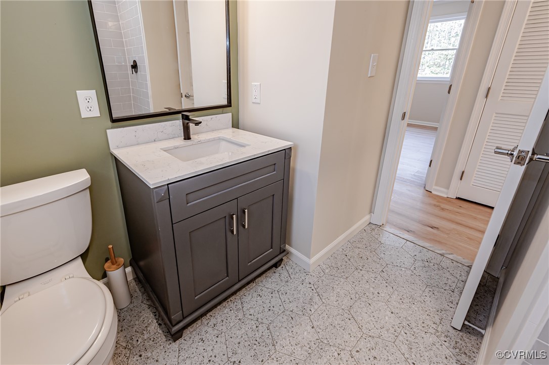 16120 Rowlett Road Chesterfield, VA 23838 - Photo 23 of 25 a bathroom with a sink a toilet and a mirror