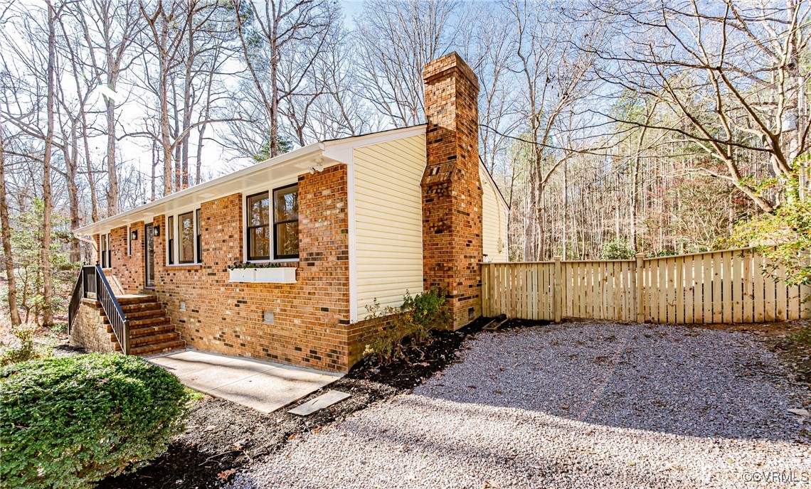 16120 Rowlett Road Chesterfield, VA 23838 - Photo 4 of 25 a backyard of a house with lots of green space