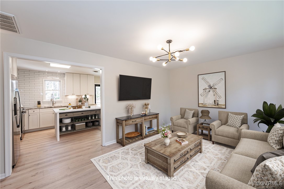 16120 Rowlett Road Chesterfield, VA 23838 - Photo 5 of 25 a living room with furniture kitchen view and a flat screen tv