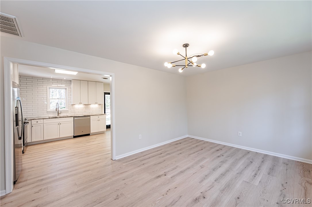 16120 Rowlett Road Chesterfield, VA 23838 - Photo 6 of 25 a view of a kitchen with a sink dishwasher a kitchen counter top space a sink and cabinets